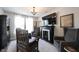 Cozy living room with a fireplace, large TV, and comfortable seating area at 4992 Fennel Dr, Pittsboro, IN 46167