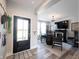 Welcoming living room with a front door, a table set, and lots of light at 4992 Fennel Dr, Pittsboro, IN 46167