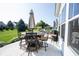 Outdoor patio with dining area and views of the backyard and surrounding neighborhood at 4992 Fennel Dr, Pittsboro, IN 46167