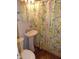 Bathroom featuring a pedestal sink and a floral shower curtain at 509 Eberhart Dr, Shelbyville, IN 46176