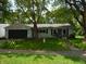 Charming single-story home with well-maintained lawn and mature trees at 509 Eberhart Dr, Shelbyville, IN 46176