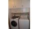 Laundry area featuring white cabinetry, washer, and dryer at 509 Eberhart Dr, Shelbyville, IN 46176