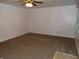 Empty living room with neutral-toned carpet at 509 Eberhart Dr, Shelbyville, IN 46176