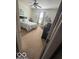 Cozy bedroom featuring neutral carpeting, a comfortable queen-size bed, and ample natural light at 5304 Appleseed Way, Indianapolis, IN 46217