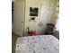 A cozy bedroom area with a double bed and a view of the closet and another door at 5304 Appleseed Way, Indianapolis, IN 46217