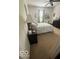 Cozy bedroom featuring neutral carpeting, a comfortable queen-size bed, and ample natural light at 5304 Appleseed Way, Indianapolis, IN 46217