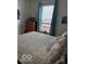 Inviting bedroom featuring a double bed, a window, and a neutral color scheme at 5304 Appleseed Way, Indianapolis, IN 46217