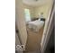 Cozy bedroom featuring a floral print comforter and a window providing natural light at 5304 Appleseed Way, Indianapolis, IN 46217