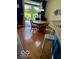 Bright eat-in kitchen with views of the backyard, bar seating, and hardwood floors at 5304 Appleseed Way, Indianapolis, IN 46217