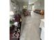 Open living area with neutral carpeting and a dining table at 5304 Appleseed Way, Indianapolis, IN 46217