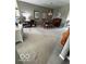 Bright dining room area with vaulted ceilings and a charming chandelier above the table at 5304 Appleseed Way, Indianapolis, IN 46217