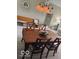 Comfortable dining area with table and chairs set under a chandelier at 5304 Appleseed Way, Indianapolis, IN 46217