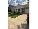Home featuring a covered porch, manicured lawn, and a two-car garage at 5304 Appleseed Way, Indianapolis, IN 46217