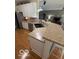 A kitchen with white cabinets, stainless steel appliances, lots of counter space, and breakfast bar seating at 5304 Appleseed Way, Indianapolis, IN 46217