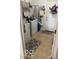 Bright laundry room featuring washer, dryer, storage shelves, and an exterior door at 5304 Appleseed Way, Indianapolis, IN 46217