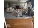 Spacious living area with neutral carpet, fireplace, and stylish furniture arrangement at 5304 Appleseed Way, Indianapolis, IN 46217