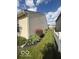 Side view of home showing well-maintained vinyl siding and manicured lawn at 5304 Appleseed Way, Indianapolis, IN 46217