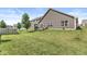 Expansive backyard with lush green grass and a charming wooden deck, perfect for outdoor entertaining and relaxation at 5409 Brandywine Dr, Whitestown, IN 46075