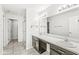 Bathroom featuring double vanity, large mirror, vanity lighting, and a tiled floor and shower at 5409 Brandywine Dr, Whitestown, IN 46075