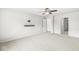 Large bedroom with plush carpeting, fan and a wall-mounted television at 5409 Brandywine Dr, Whitestown, IN 46075
