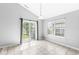 Bright dining area with tile floor, patio door with backyard view and a window with privacy blinds at 5409 Brandywine Dr, Whitestown, IN 46075
