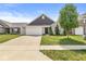 Attractive home with a brick and siding exterior, a two-car garage, and a well-manicured lawn, offering great curb appeal at 5409 Brandywine Dr, Whitestown, IN 46075