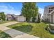 A well-kept home with a brick and siding exterior, a two-car garage, and a manicured lawn, enhancing its curb appeal at 5409 Brandywine Dr, Whitestown, IN 46075