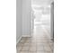 Clean hallway with tile flooring, leading to other rooms, showcasing a well-maintained and spacious layout at 5409 Brandywine Dr, Whitestown, IN 46075