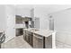 Spacious kitchen with dark cabinets, stainless steel appliances and a large center island with double sink at 5409 Brandywine Dr, Whitestown, IN 46075