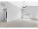 Expansive living room features vaulted ceilings, neutral carpet, and a ceiling fan for comfortable living at 5409 Brandywine Dr, Whitestown, IN 46075
