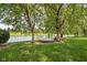 Backyard lounging area next to the water, perfect for relaxing outdoors at 5695 N Red Oak Dr, Greenfield, IN 46140
