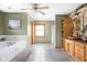 Bathroom featuring a soaking tub, shower, and vanity with storage space at 5695 N Red Oak Dr, Greenfield, IN 46140