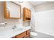 Well-lit bathroom featuring a vanity, mirror, and shower with a patterned curtain at 5695 N Red Oak Dr, Greenfield, IN 46140