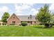 Charming single Gathering home featuring a well maintained lawn and landscaping at 5695 N Red Oak Dr, Greenfield, IN 46140
