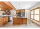 Bright kitchen featuring a center island, and views of the dining and living areas at 5695 N Red Oak Dr, Greenfield, IN 46140