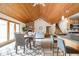 Open-concept living space with wood ceiling and seamless flow to the dining area and kitchen at 5695 N Red Oak Dr, Greenfield, IN 46140