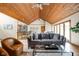 Spacious living room featuring an open floor plan and wood-paneled ceiling at 5695 N Red Oak Dr, Greenfield, IN 46140