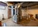 Basement with exposed brick and a new Daikin HVAC system installed at 6101 Broadway St, Indianapolis, IN 46220