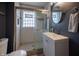 Updated bathroom with a subway tile shower and modern vanity at 6101 Broadway St, Indianapolis, IN 46220