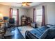 Bedroom with hardwood floors, a ceiling fan, and natural light at 6101 Broadway St, Indianapolis, IN 46220