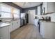 Updated kitchen features stainless steel appliances, white cabinetry and granite countertops at 6101 Broadway St, Indianapolis, IN 46220