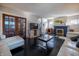 Bright living room with hardwood floors, fireplace, and modern furniture at 6101 Broadway St, Indianapolis, IN 46220