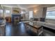 Bright living room with hardwood floors, fireplace, and modern furniture at 6101 Broadway St, Indianapolis, IN 46220