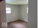 Cozy bedroom featuring neutral walls and carpeted floors, creating a serene atmosphere at 618 W Mckenzie Rd, Greenfield, IN 46140