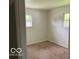 Bedroom featuring neutral walls and carpeted floors, creating a serene atmosphere at 618 W Mckenzie Rd, Greenfield, IN 46140