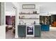 A quaint bar featuring a beverage cooler, ample storage, and stylish decor at 6464 Whitley Ln, Indianapolis, IN 46260
