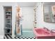 Quirky bathroom with modern fixtures, a unique shower curtain, and black and white tile at 6464 Whitley Ln, Indianapolis, IN 46260