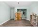 Bright bedroom with walk-in closet, wood floors, and decorative folding screen at 6464 Whitley Ln, Indianapolis, IN 46260