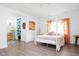 Bright bedroom with canopy bed, colorful curtains, and whimsical decor at 6464 Whitley Ln, Indianapolis, IN 46260