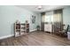 Bedroom featuring hardwood floors, ample natural light, and a calm, inviting space at 6464 Whitley Ln, Indianapolis, IN 46260